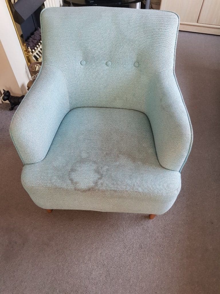 A light blue chair in a living room.